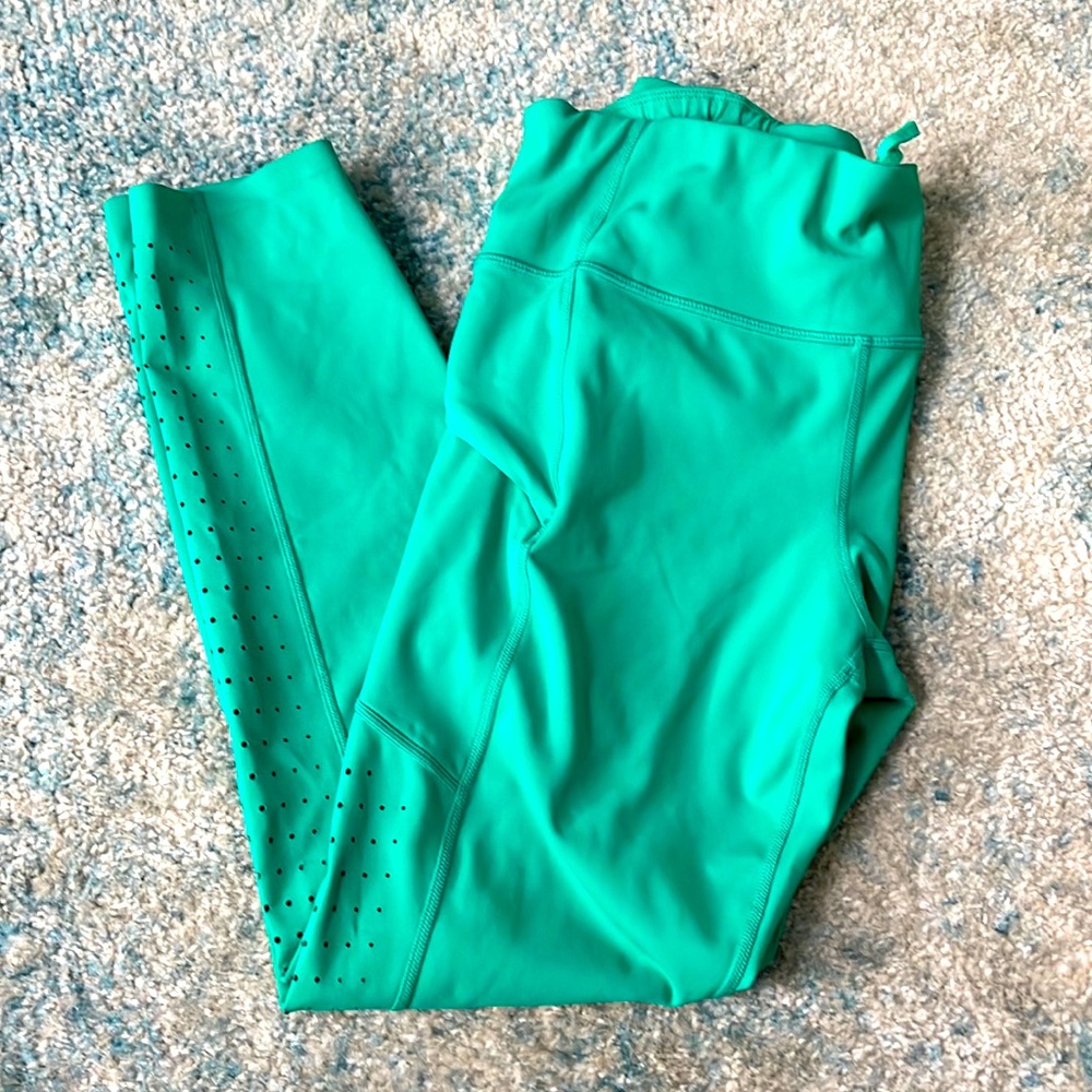 Athleta green 7/8 performance tights size M